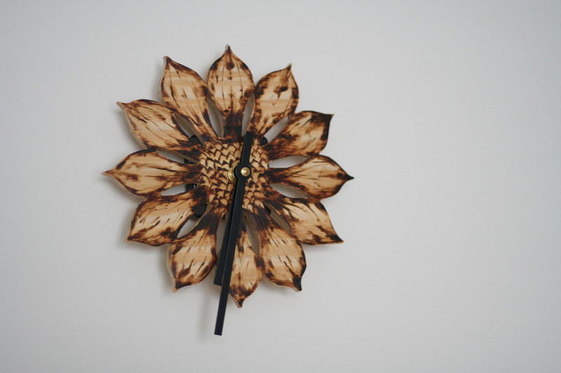 Ryder's cut wooden flower clock